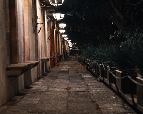 Quiet evening route lit by streetlamps in a high-altitude Mexican city